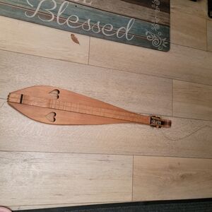 Wooden String Instrument with Heart Cutouts